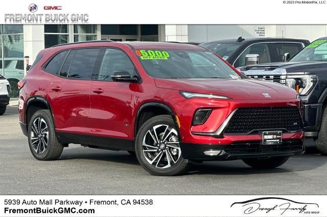 2025 Buick Enclave Sport Touring in Cherry Red Tintcoat — front three-quarter view